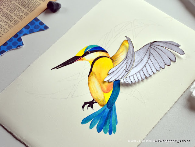 Checking the wings for a good fit before cutting them out of collage papers