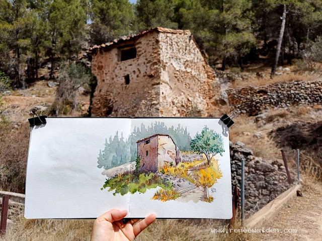 Abandoned stone building above an old aqueduct.