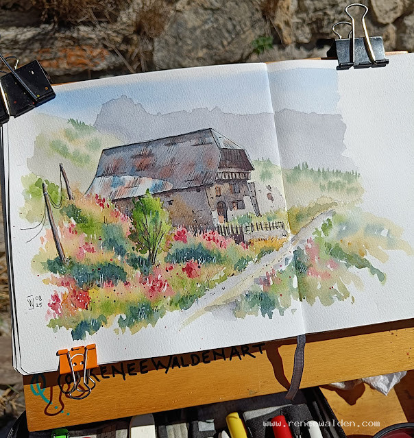 Old house nestled in vibrant fireweed, Ubaye Valley.