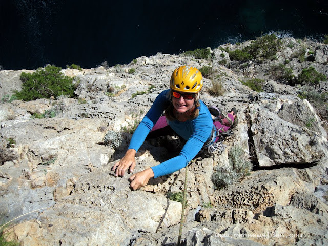 Climbing on Pedra Longa. 7 lovely pitches with the waves crashing below
